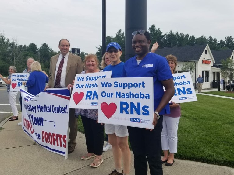 LGWR Student Sherif Olanrewaju (right front) with The Massachusetts Nurses Association at an action in front of the Nashoba Valley Medical Center.