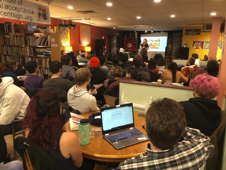 Assistant Professor Rebecca Tarlau addresses a packed house at Webster’s Bookstore and Cafe.