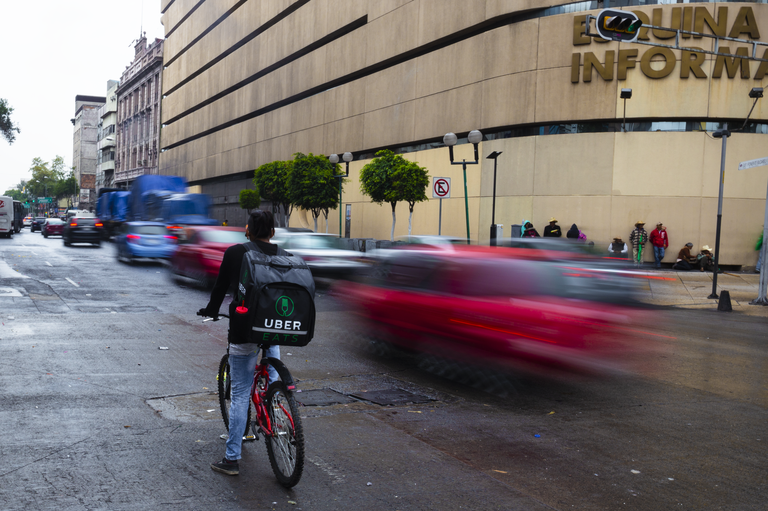 An Uber Eats rider makes a delivery in Mexico City.(Photo Credit: Stefano Morrone)