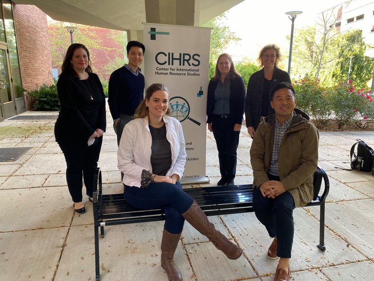 Members of CIHRS sit outside Kern and pose for a photo