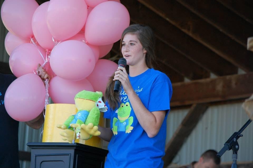 Kylie Kuhns introduces Hopper the Cancer Crusher to the public at one of the annual events held by Kelsey’s Dream.IMAGE: PHOTO PROVIDED BY KYLIE KUHNS